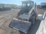 Bobcat 773 skid steer loader with solid tires and GP bucket