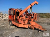 Chiparvestors towable chipper with integrated log grapple with Diesel engine