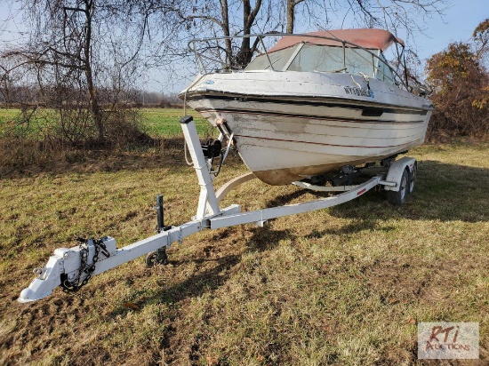 Fisherman 210 Thompson boat with inboard motor on tandem trailer