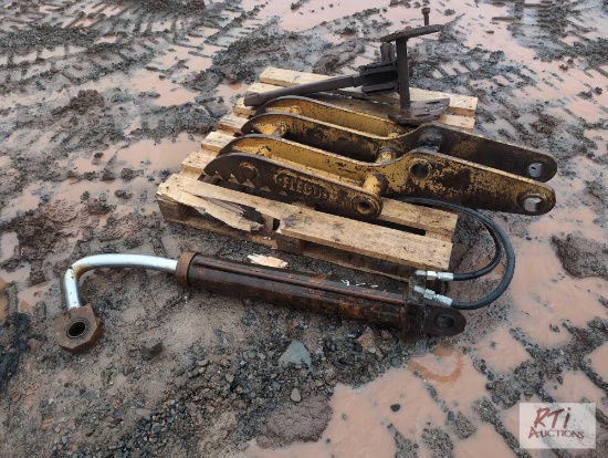 Excavator thumb with broken hydraulic cylinder and homemade ripper