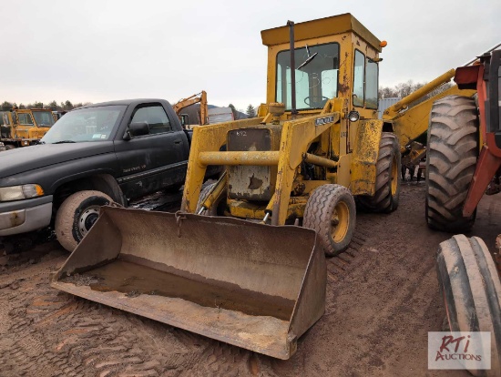 John Deere 410 backhoe, cab, GP bucket, 24in digging bucket