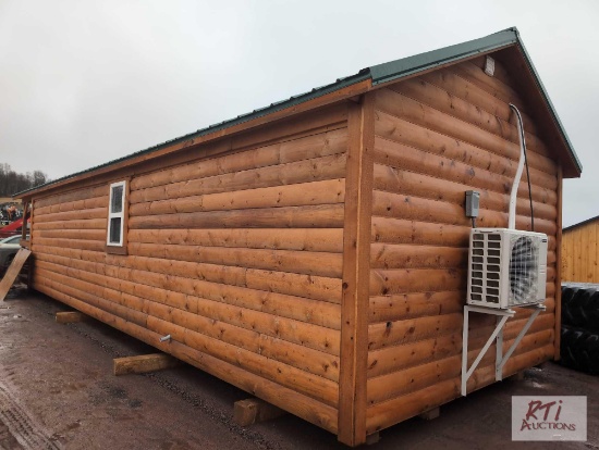 Log cabin with kitchen, bathroom, bedroom, insulated, plumbed, wired, front porch, 42ft with mini