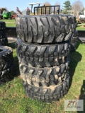 4X Forerunner 12-16.5 skid loader tires on New Holland rims