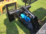 Skid loader tree spade with hydraulic grapple