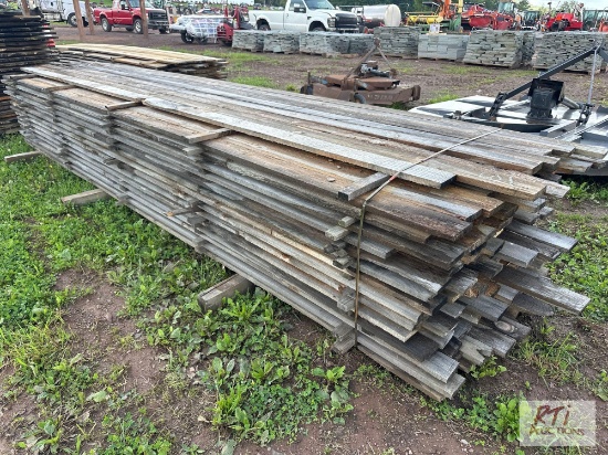 Large pile of 4in x approximately 14ft rough cut lumber. Quantity and measurements are estimates.