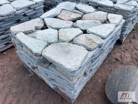 Pallet of tumbled bluestone pavers.