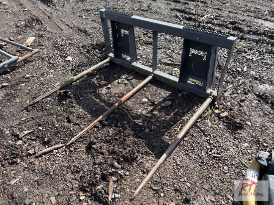 Bale spear for skid loader.