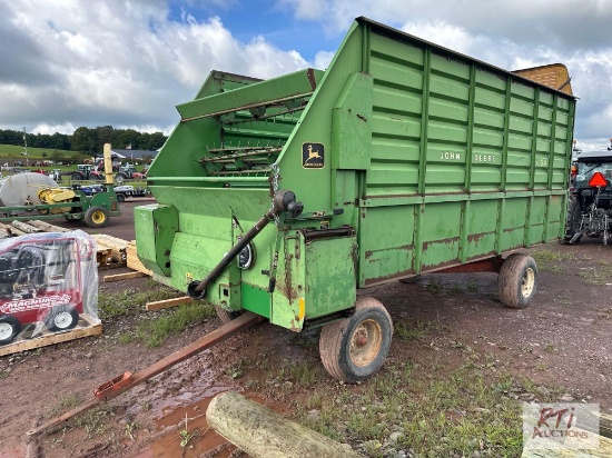 John Deere 716A self unloading forage wagon.