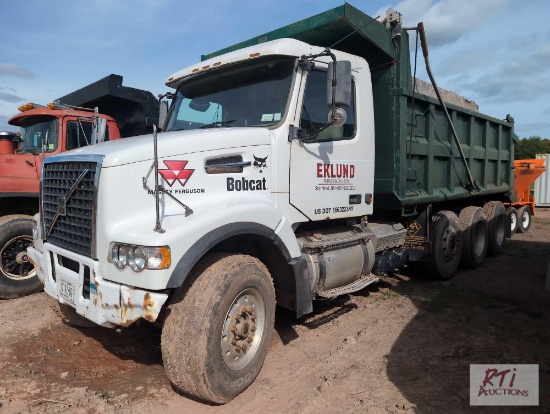 2002 Volvo 10 wheel dump truck with steerable tag, steel body, 465hp, 20K front, 46K rears, one