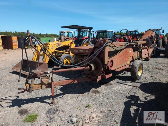 New Holland 310 hay baler with bale thrower.