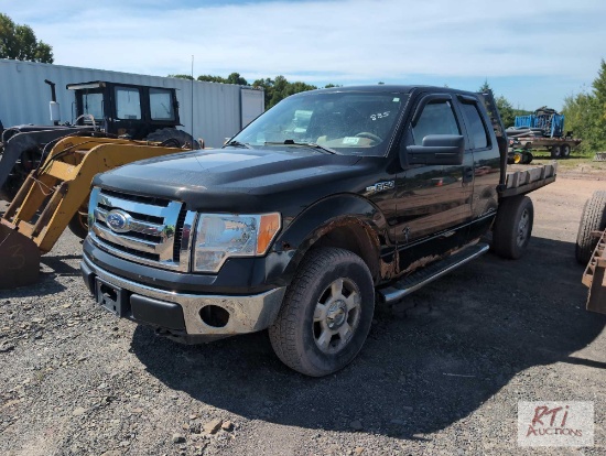 2010 Ford F-150 pickup with flatbed
