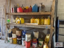 Rack of fuel cans and fluid buckets