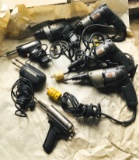4 Black & Decker Electric Hand Drills, 3 Solder Guns in unknown condition.