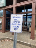 Pair of Mountain Grill Express Parking Signs