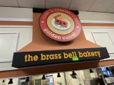 the brass bell bakery Sign
