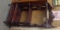 Three tier etagere with pierced crest and single drawer base  59 by 26 by 15