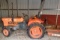 Kubota 235 4 wheel drive Tractor with bush hog and scraper blade in very good condition
