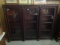 1800's three door mahogany bookcase with carved column inserts, bun feet  54 by 70 by 14
