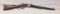 Model 1873 38 cal Winchester having saddle ring and original slide plate with adjustable sight , thi