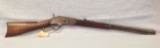 Model 1873 32 cal Winchester having original slide plate and octagon barrel  serial number 319577B