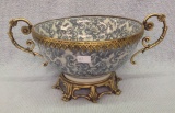 Blue decorated Porcelain Bowl on brass feet with brass trim 8 by 13