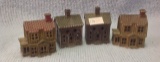 Four Cast Iron Small banks in form of houses