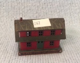 Early PT Corporation Metal House Bank with coins 2.5 by 4