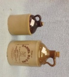 Two single finger Whiskey Jugs with corks