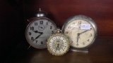 Three Alarm Clocks, one Big Ben, one Lord Baltimore and one other