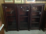 1800's three door mahogany bookcase with carved column inserts, bun feet  54 by 70 by 14