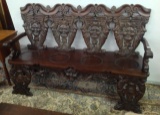 Very ornate highly carved four person Bench with heads and figural carved back, northwind head on ba