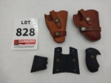 2 leather holsters and 3 pistol grips