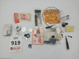 assortment of gu parts, safety glass, gun lock