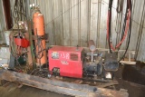 LINCOLN MODEL 225 PORTABLE WELDER W/ TORCH HOSES & GUAGES W/ METAL STAND