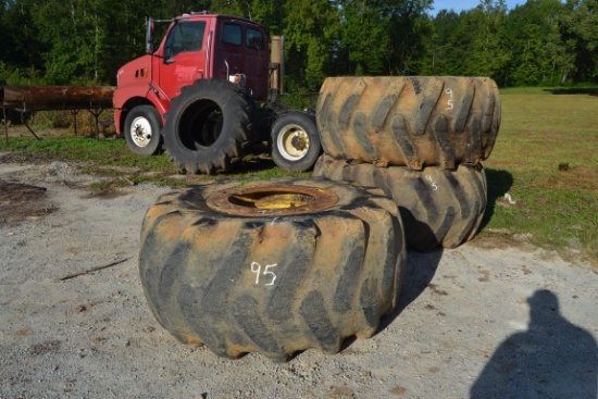 (3) 28LX26 SKIDDER TIRES ON JOHN DEERE RIMS