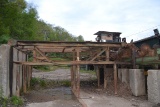 DESIGNED AUTOMATION 26' 4 STRAND LOG DECK W/ 4 ARM STOP & LOADER W/ ELECTRIC DRIVE