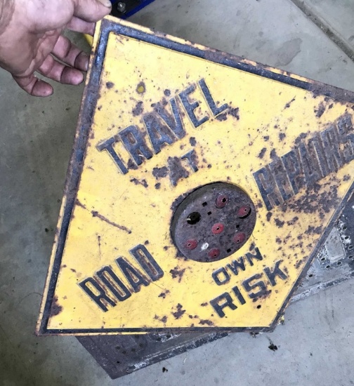 Embossed Travel At Own Risk Sign