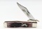 2002 Case XX Cranberry Bone Silver Script Cheetah