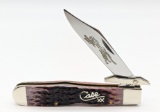 2002 Case XX Cranberry Bone Silver Script Cheetah