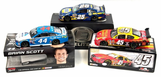 (3) 1:24 Autographed Richard Petty & Brian Scott, Kyle Petty, And Chase Elliot Diecast Collectables