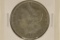 1887-O MORGAN SILVER DOLLAR. REVERSE HAS SOME