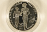 1995-P US PF SILVER $1 OLYMPIC RUNNING. IN HARD