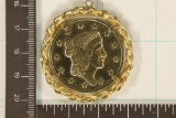 GOLD COLORED PENDANT WITH A 1976 UNITED STATES