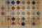 40 ASSORTED COLORIZED ALUMINUM MARDI GRAS TOKENS: