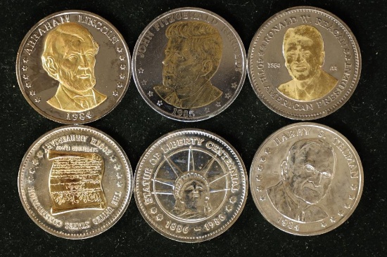 6 DOUBLE EAGLE METAL TOKENS.  4 ARE PARTIALLY