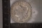 1884-O MORGAN SILVER DOLLAR IN HARD PLASTIC