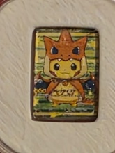 Auction photo of 1 GRAM POKEMON PIKACHU CHARIZARD 999.0 SILVER BAR