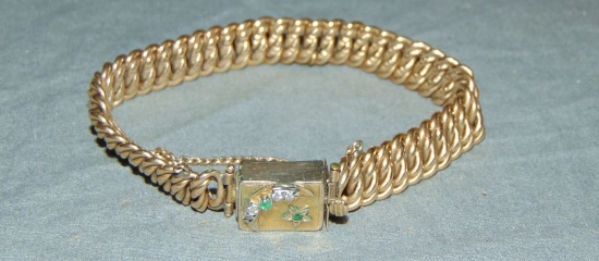 Diamond and Emerald Curb Link Bracelet.