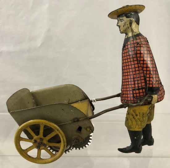 Unusual Girard Man Pushing Cart
