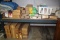 Contents of (2) Sections of Shelving to Include: Building Supplies, Bi-Fold